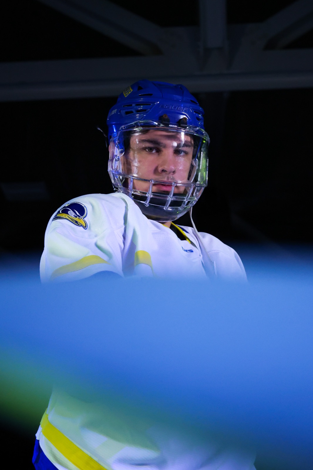 Delaware Blue Hens hockey player in helmet looking at camera at media day