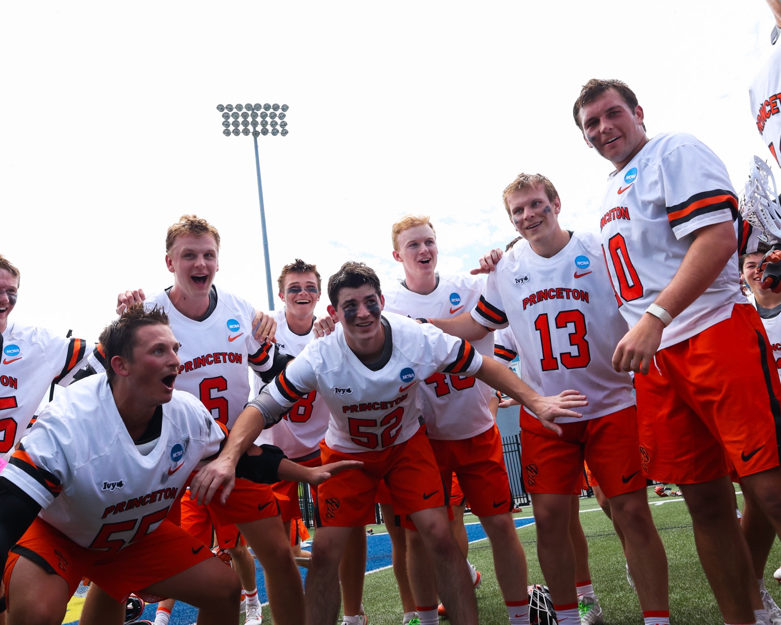 Princeton lacrosse players celebrating after the NCAA quarterfinal win